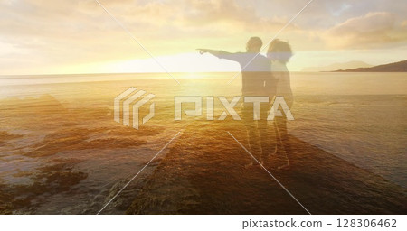 Image of happy african american couple enjoying sunset at beach over sea Image of happy african american couple enjoying sunset at beach over sea 128306462