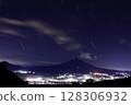The view of Mt. Fuji lit up by summer mountain climbing lights beyond the city night view 128306932
