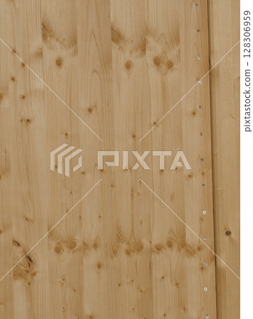 A wooden surface with a grain pattern and a few holes A wooden surface with a grain pattern and a few holes 128306959