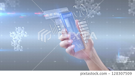 Hand interacting with transparent smartphone displaying futuristic digital interface Hand interacting with transparent smartphone displaying futuristic digital interface 128307509