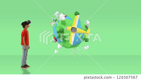 Young boy using VR headset exploring virtual world with 3D animated planet 128307567