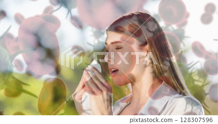 Woman sneezing outdoors, holding tissue, surrounded by pollen and allergens Woman sneezing outdoors, holding tissue, surrounded by pollen and allergens 128307596