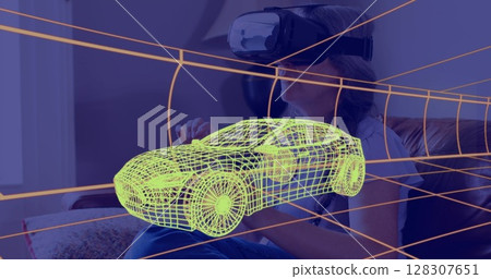 Image of 3d technical drawing of car, over woman at home wearing vr headset Image of 3d technical drawing of car, over woman at home wearing vr headset 128307651