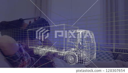 Image of 3d technical drawing of truck, over woman at home wearing vr headset Image of 3d technical drawing of truck, over woman at home wearing vr headset 128307654