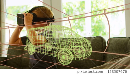 Image of 3d technical drawing of van, over boy at home wearing vr headset 128307676