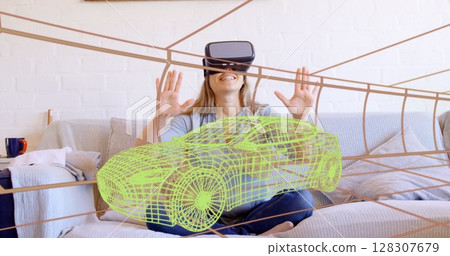 Image of 3d technical drawing of car, over woman at home wearing vr headset 128307679
