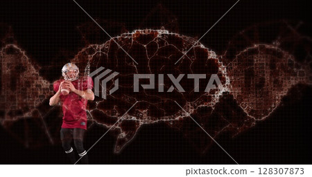Image of digital brain spinning over male american football player holding ball Image of digital brain spinning over male american football player holding ball 128307873