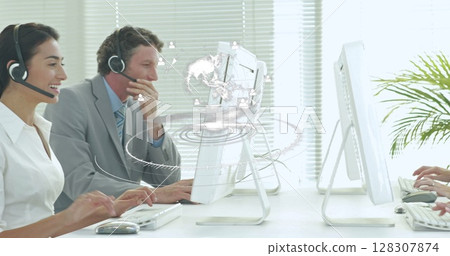 Image of network of connections over happy diverse office workers wearing headsets Image of network of connections over happy diverse office workers wearing headsets 128307874