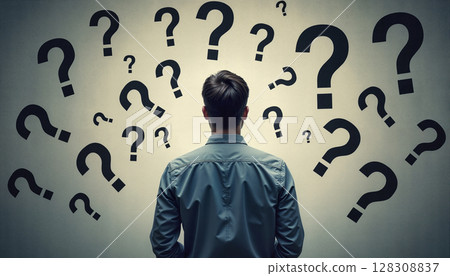 A man stands with his back to the viewer, facing a wall covered in various-sized question marks, symbolizing uncertainty and confusion. - Generic AI Image 128308837