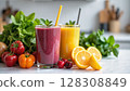 Two vibrant glasses of fruit smoothies, one purple and one yellow, are surrounded by fresh fruits and vegetables on a kitchen counter. - Generic AI Image 128308849