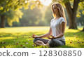 A serene woman meditates in a peaceful park setting during golden hour, embodying tranquility and mindfulness. - Generic AI Image 128308850