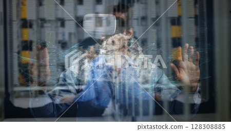 Digital composite of businessman using VR, touching screen and having a digital cloud image appear, 128308885