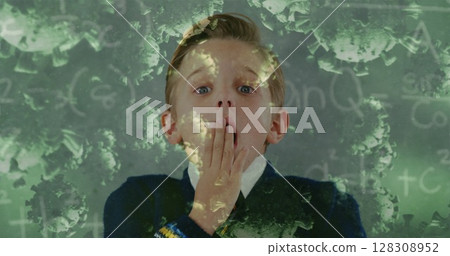 Image of Covid 19 coronavirus cells spreading over surprised schoolboy in class with chalkboard in t Image of Covid 19 coronavirus cells spreading over surprised schoolboy in class with chalkboard in t 128308952