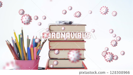 Image of Covid 19 coronavirus text and cells spinning, over desk with stack of books and school item 128308966