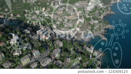 Image of Covid 19 icons flowing over aerial view of cityscape 128309125