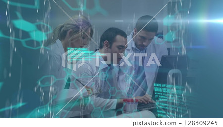 Digital compote image of medical digital interface against team of doctors using computer 128309245