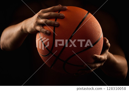 Basketball ball in male hands 128310058