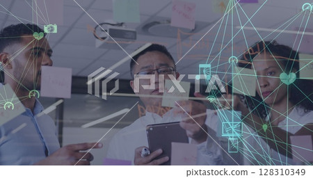 Image of network of connected media icons with business people brainstorming at a meeting 128310349