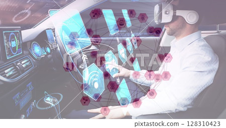 Image of connected icons and information displays with man in vr headset using self driving car Image of connected icons and information displays with man in vr headset using self driving car 128310423