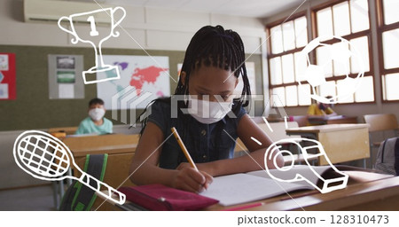 Image of school items icons over schoolgirl in face mask writing 128310473
