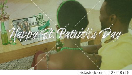 Image of happy st patrick's day text over couple celebrating with friends on laptop image call 128310516
