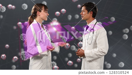 Image of covid 19 cells and statistics recording over male and female doctors talking 128310524