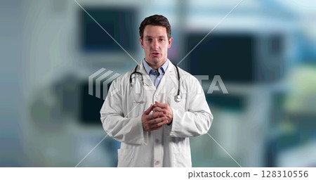 Portrait of caucasian male doctor talking looking at camera against hospital in background 128310556