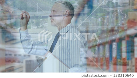 Image of data processing over businessman counting stock in warehouse shipping centre 128310640