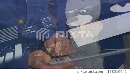 Image of data processing over warehouse workers using tablet in shipping centre 128310641