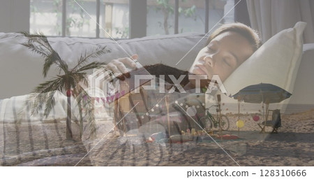 Image of beach bar and seaside over woman sleeping with book on sofa at home 128310666