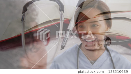 Image of stethoscope over female doctor with senior woman smiling 128310689