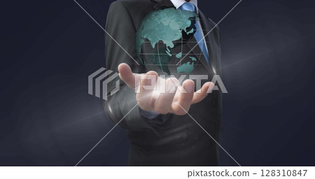 Image of globe spinning over businessman hand in background 128310847