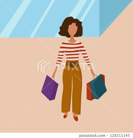 Beautiful girl on a shopping trip with bags in her hands. Beautiful girl on a shopping trip with bags in her hands. 128311145