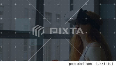 White particles moving over grid network against caucasian woman wearing vr headset at home White particles moving over grid network against caucasian woman wearing vr headset at home 128312101