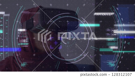 Image of scope scanning over smiling woman in hijab wearing vr headset 128312107