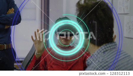 Neon scope scanner and light trails against caucasian man wearing vr headset at office Neon scope scanner and light trails against caucasian man wearing vr headset at office 128312113