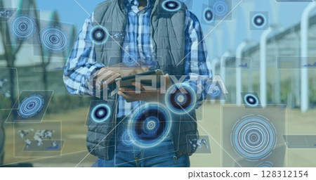 Image of scope scanning and data processing on screens over man using tablet Image of scope scanning and data processing on screens over man using tablet 128312154