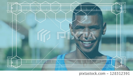 Image of frame with markers over portrait of smiling male football player 128312391