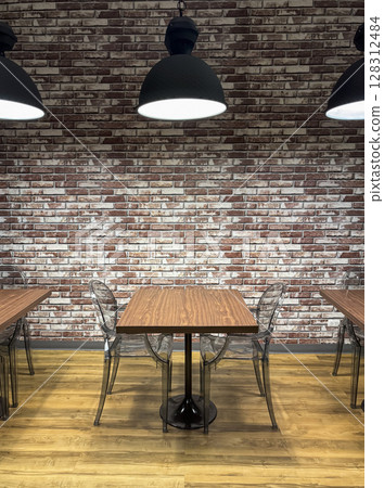 Inviting space with wooden tables and clear chairs in a modern library setting 128312484