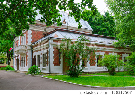Museum-estate of 19th century Kozell-Poklevsky (Gatovsky) in village of Krasny Bereg, Gomel region, Belarus. Former servants' quarters Museum-estate of 19th century Kozell-Poklevsky (Gatovsky) in village of Krasny Bereg, Gomel region, Belarus. Former servants' quarters 128312507