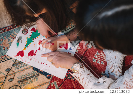 Creating Colorful Christmas Drawing Together 128313083