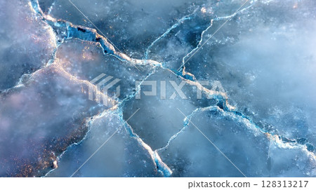 Abstract close-up of an icy, crystalline structure with intricate, fractured patterns. 128313217