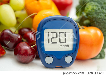 Glucose meter with vegetable and fruit for check sample blood sugar level to treatment diabetes. Glucose meter with vegetable and fruit for check sample blood sugar level to treatment diabetes. 128313320
