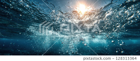 An underwater scene with sunlight, bubbles and water movement. 128313364