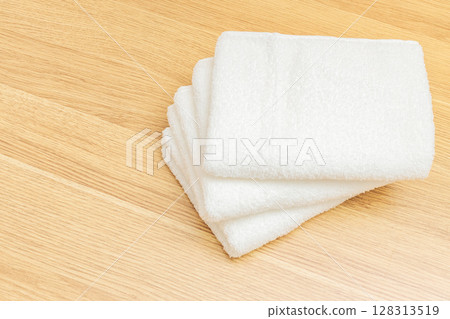 Folded white face towel 128313519