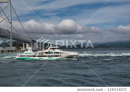 A sightseeing boat sailing through the Naruto Strait A sightseeing boat sailing through the Naruto Strait 128314072