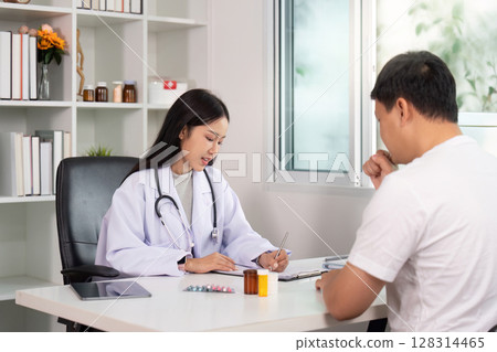 Healthcare. Doctor consulting patient about treatment plan. 128314465