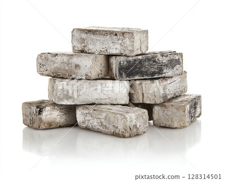 Old weathered bricks stacked on white background. Rustic construction blocks with texture, ideal for vintage design projects. 128314501