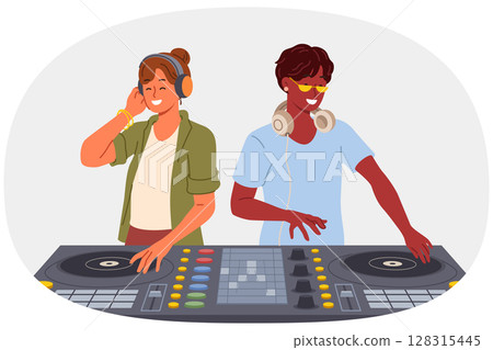 Two DJ use mixing console to entertain visitors to disco in nightclub and play original musical hits 128315445