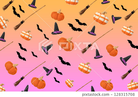 Abstract gradient orange purple background for Halloween holiday decorations in the form of a knitted witch's hat, a broom, black bats and an orange knitted pumpkin flying in the air. Halloween 128315708